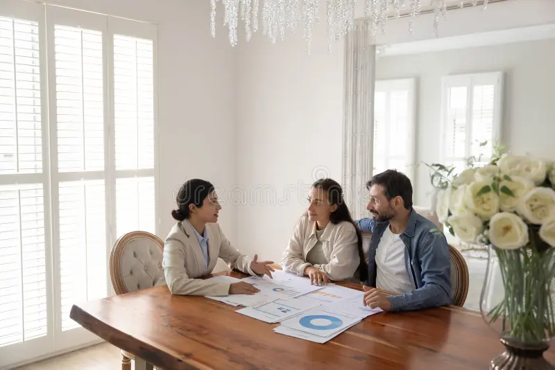 family finance coaching focused husband wife sit table female financial advisor tax accountant investment specialist learn 411236473